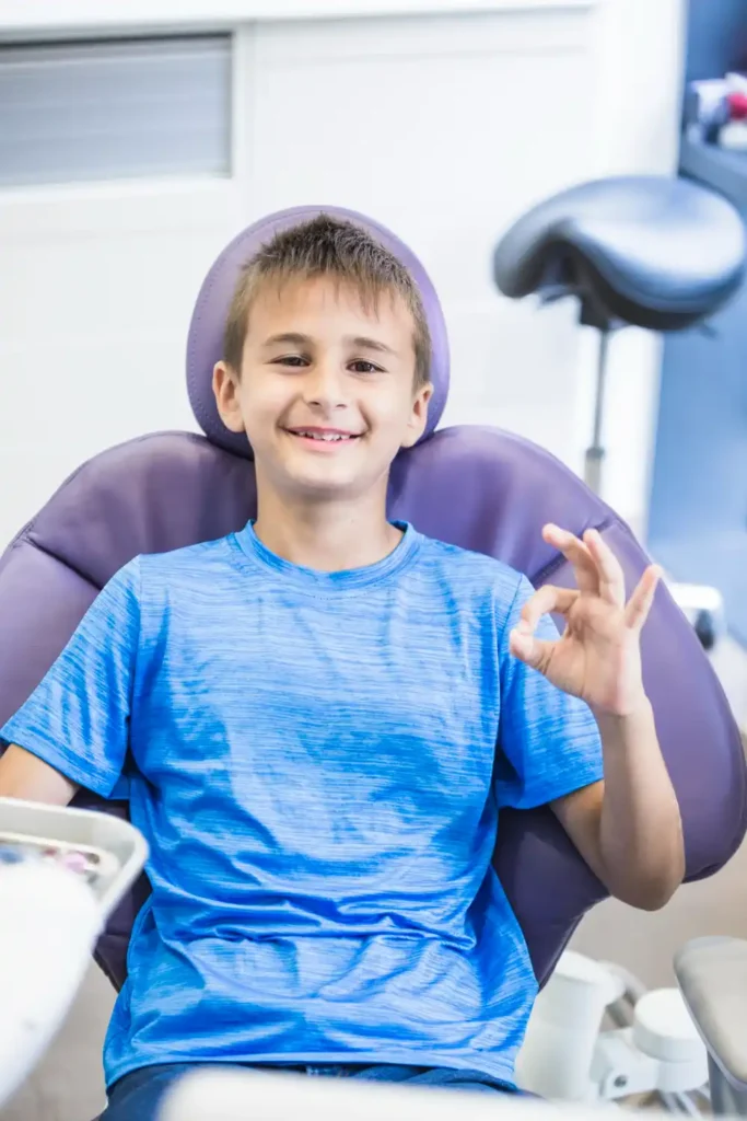 smiling child in dental chair